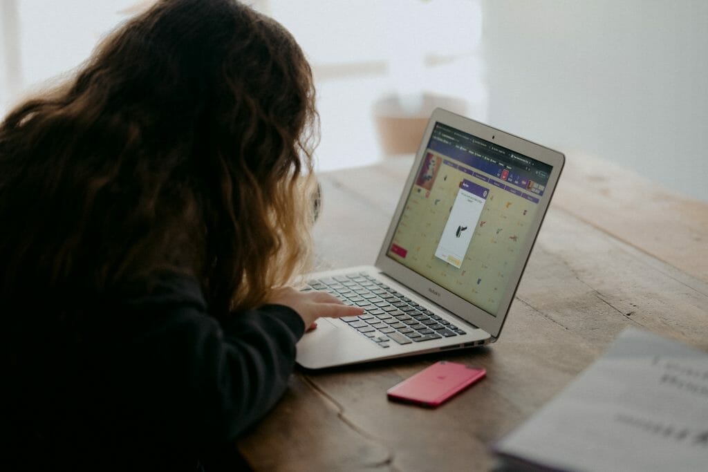 woman doing homework at laptop