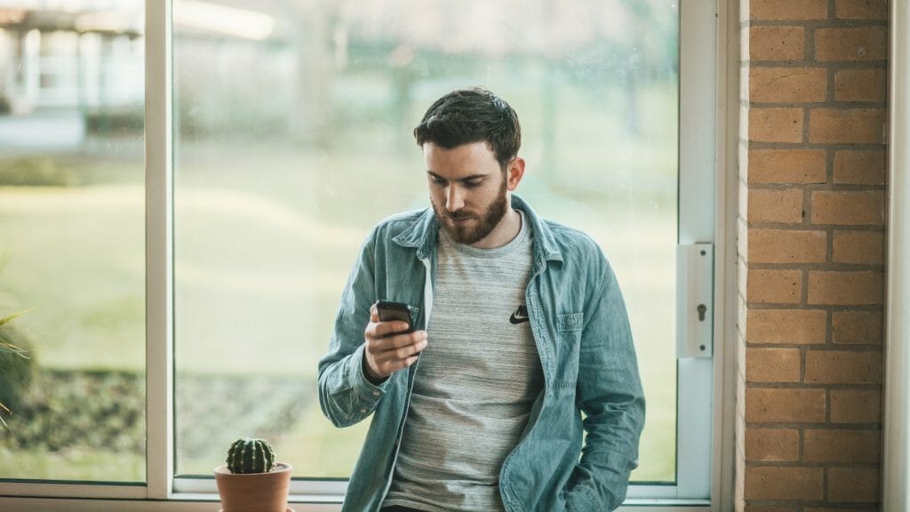 man-holding-phone-in-hand