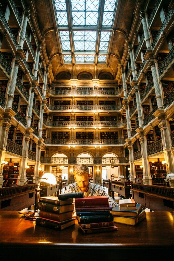 man-studying-in-a-library