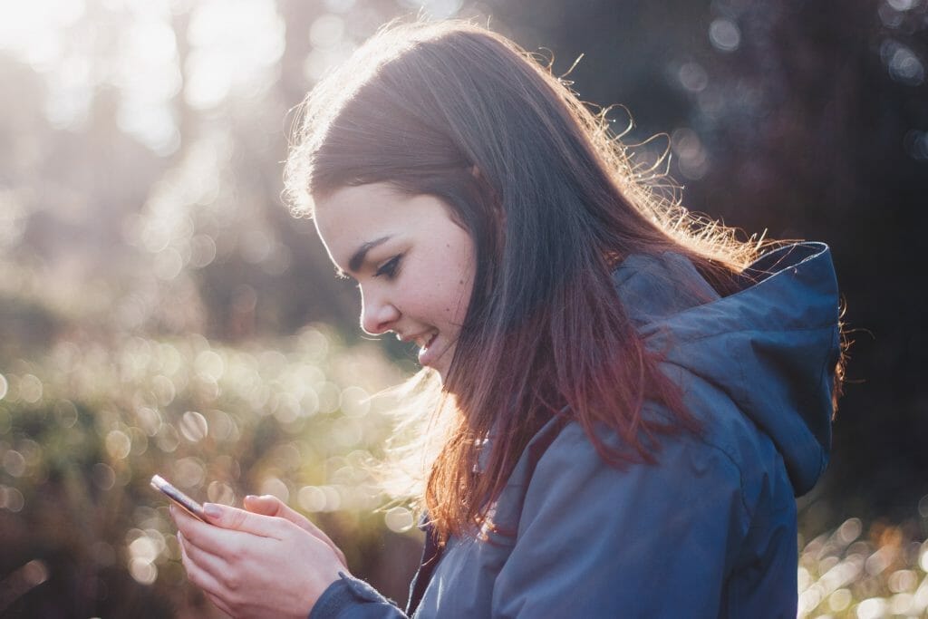 woman-calling-friends-on-phone