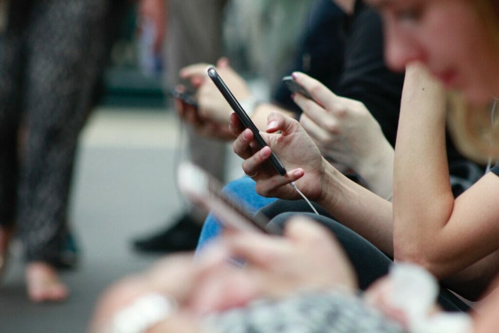 hands using smartphones