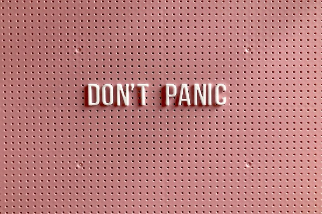 pink-board-that-says-don't-panic