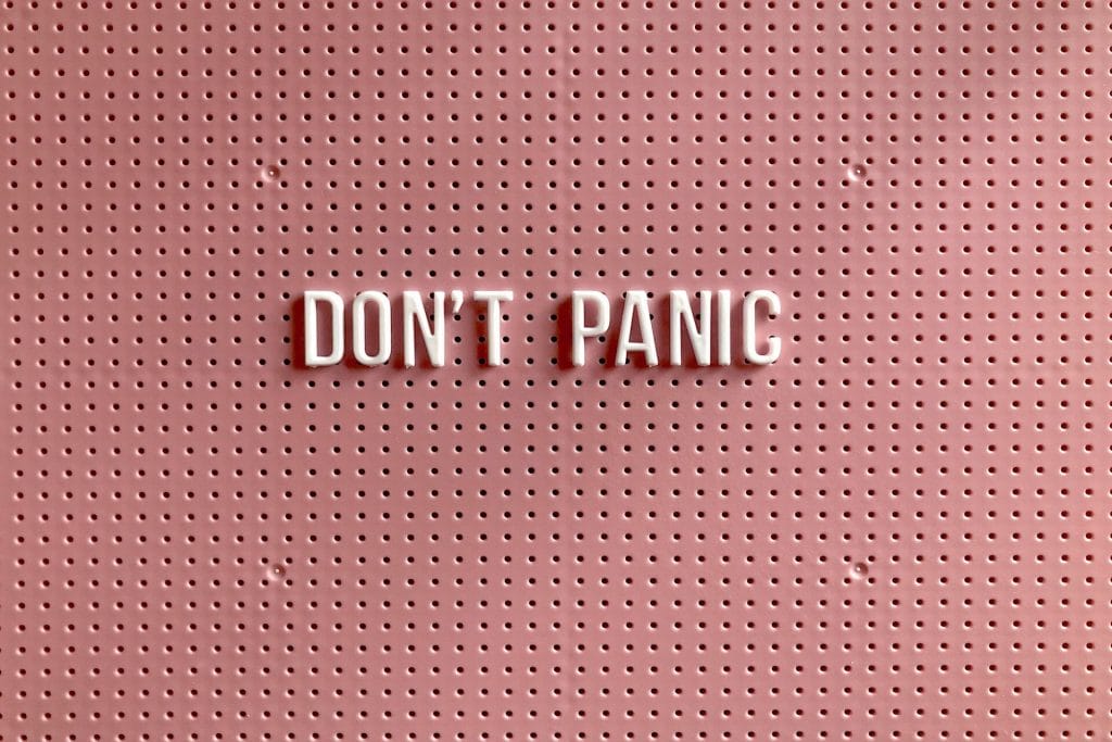 pink-board-that-says-don't-panic