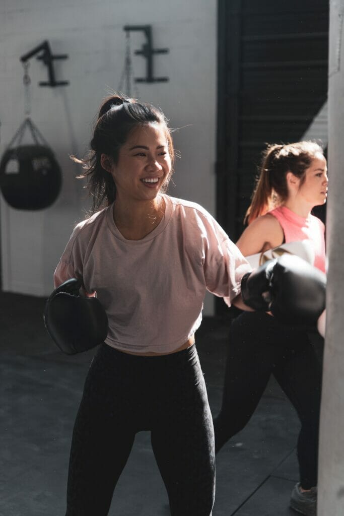 woman boxing with a smile on her face