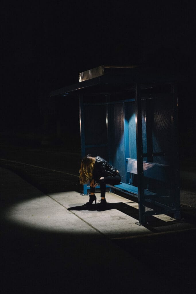 woman alone at bus station