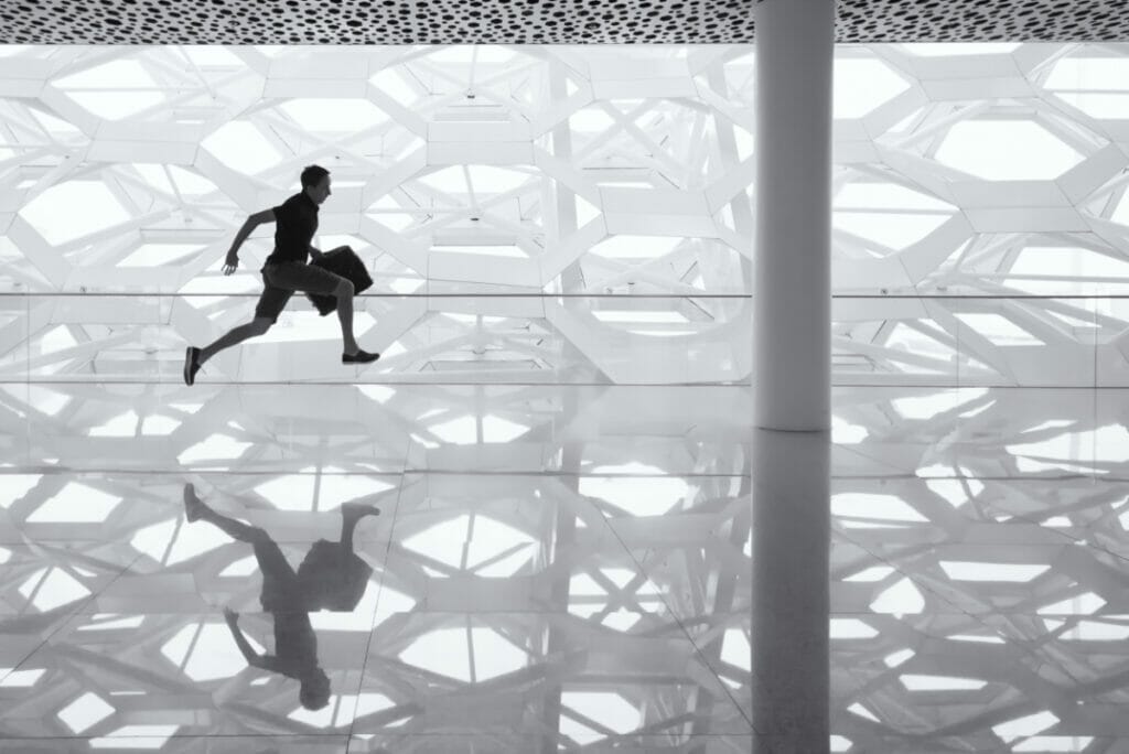 man running with a briefcase